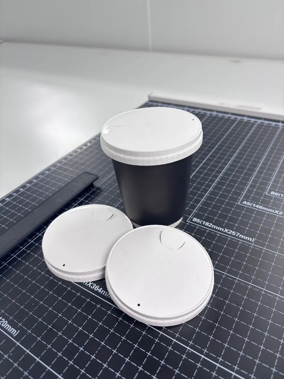 Paper lids with cup